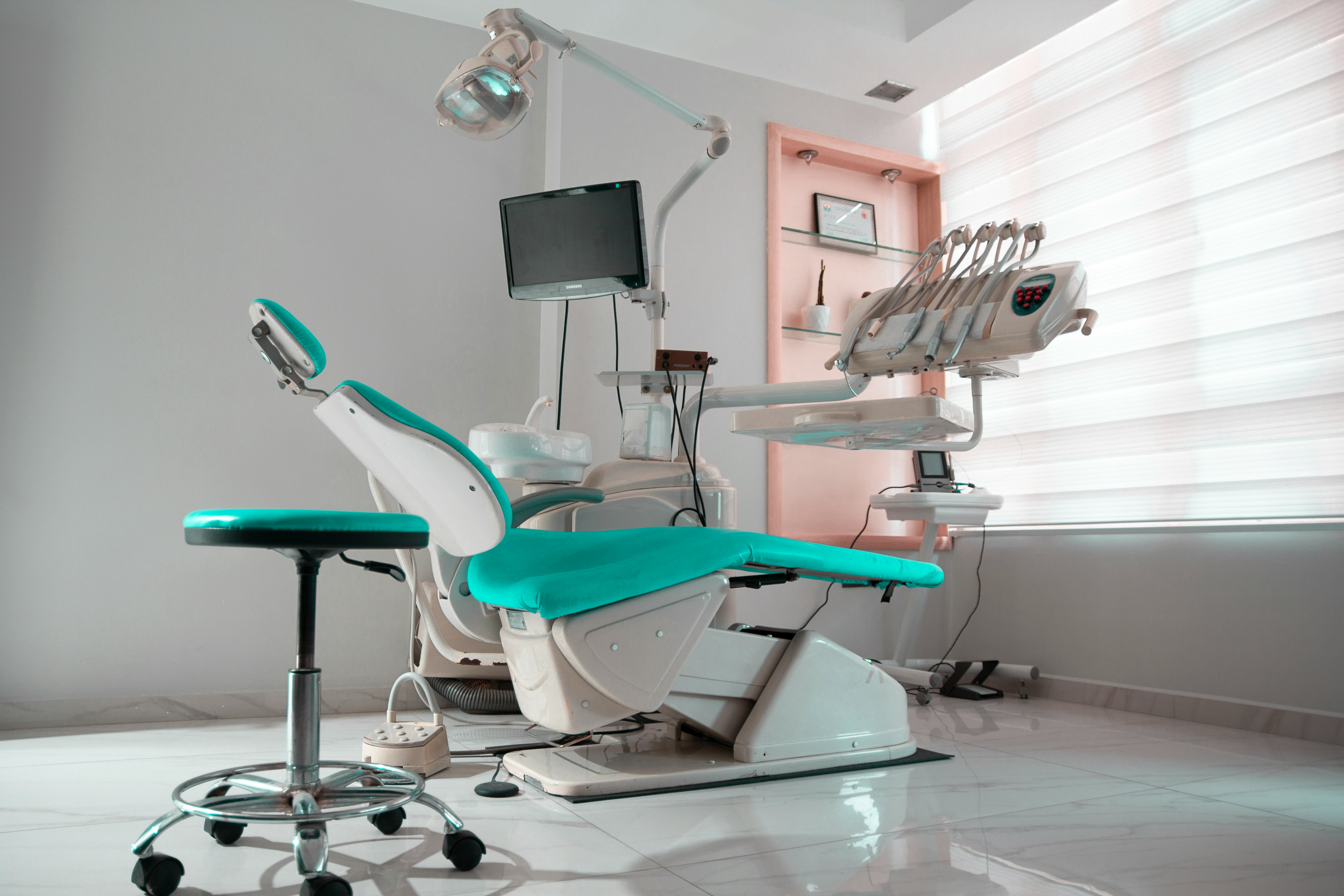 Modern dental practice operatory showing the business complexity dentists manage daily
